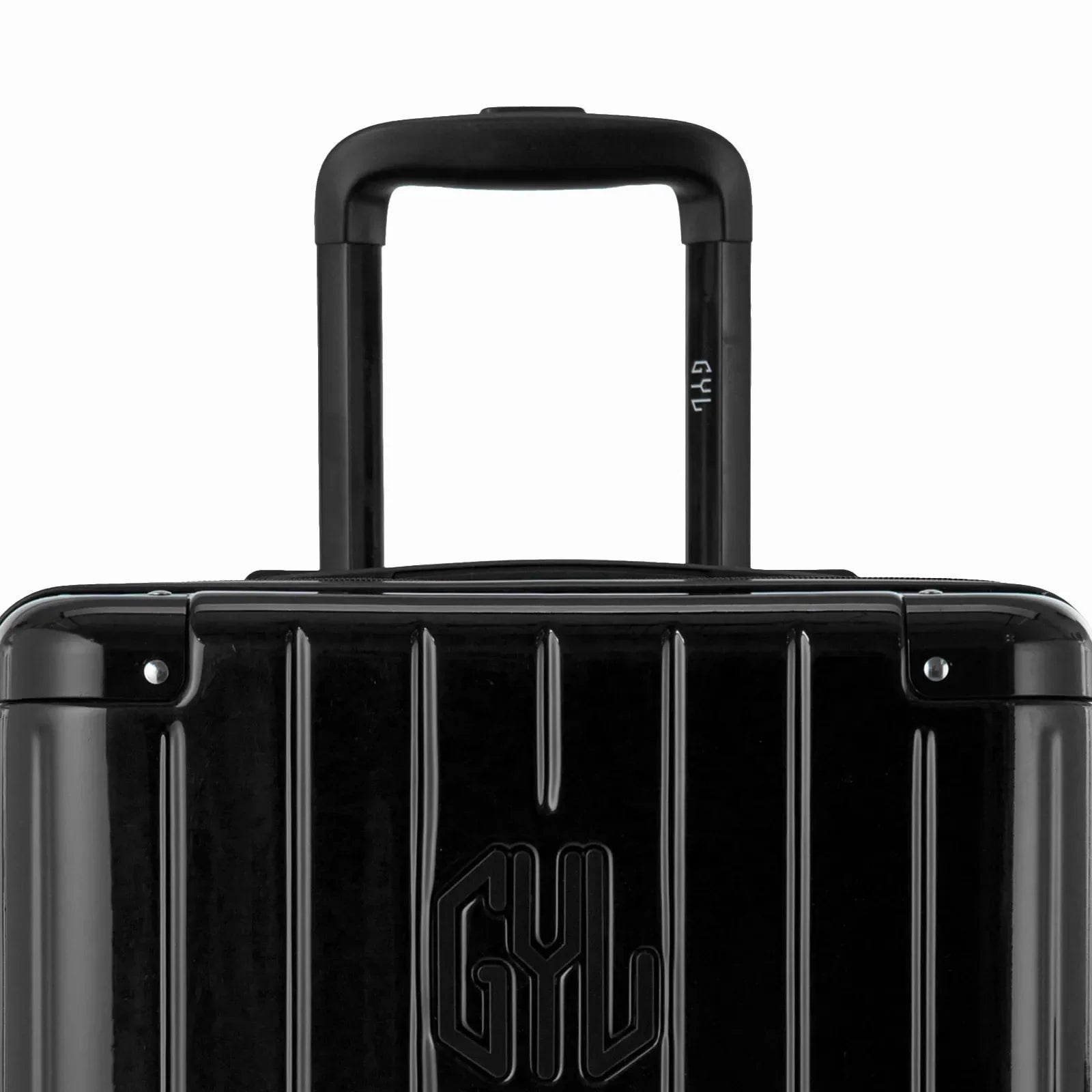 Zoom sur la poignée trolley et le logo GYL de la valise trunk noir. #couleur_noir