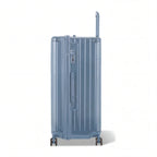 Dos de la valise trunk GYL XL bleu gris avec trolley télescopique sorti et logo embossé. #couleur_bleu grisé