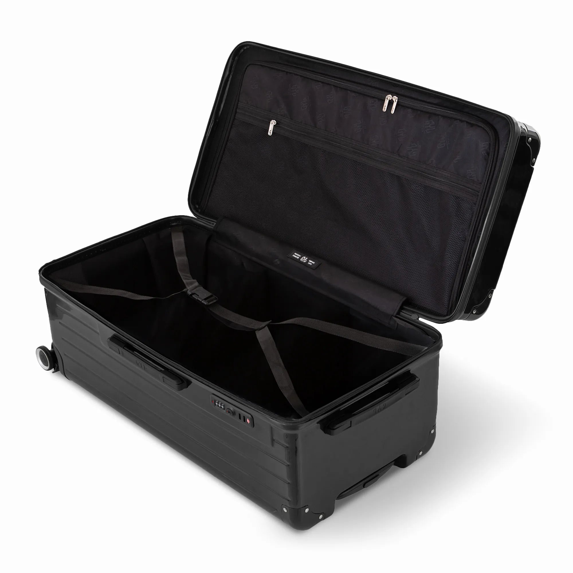 Intérieur de la valise trunk GYL XL noir ouvert, avec sangles croisées et compartiments de rangement. #couleur_noir