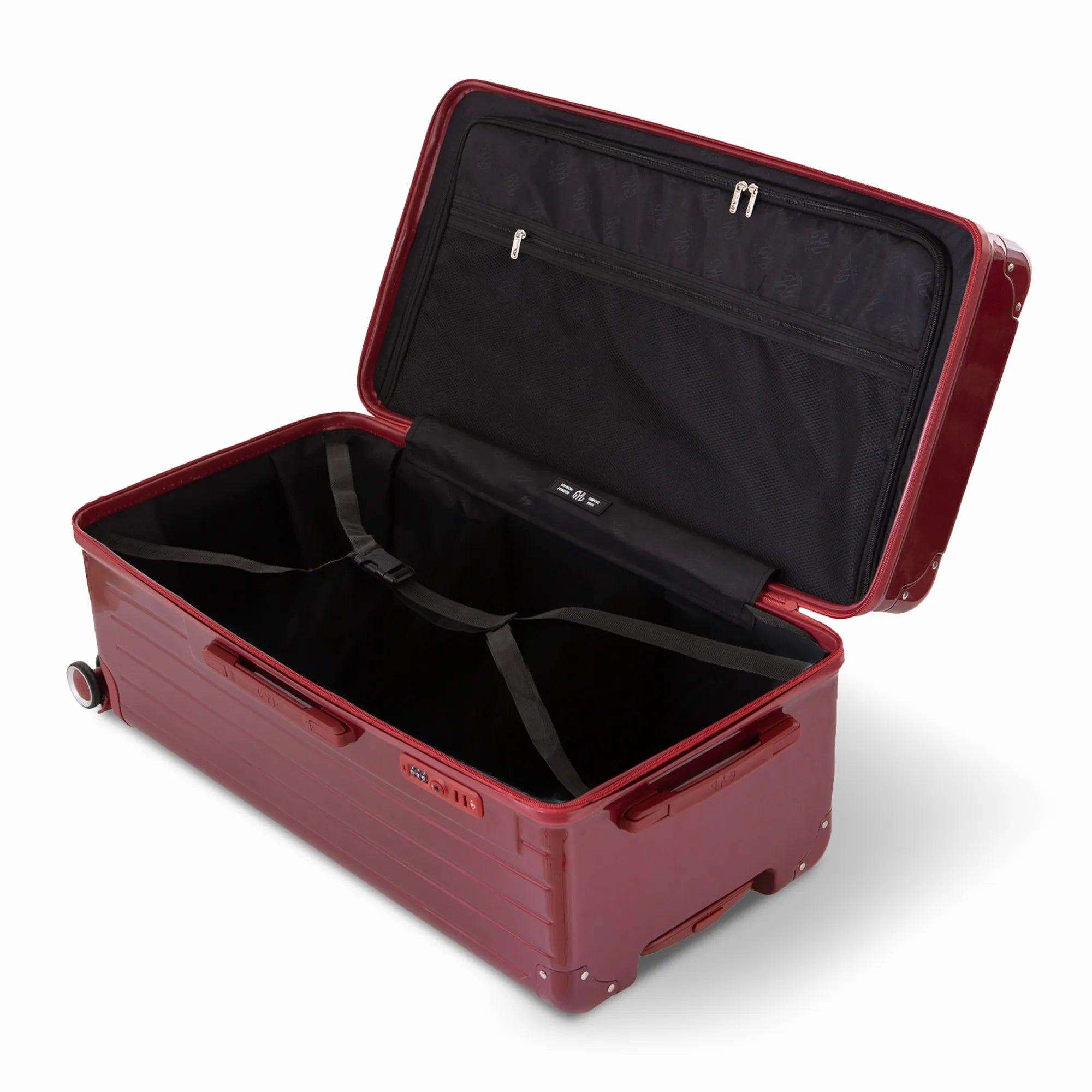 Intérieur de la valise trunk GYL XL rouge foncé ouvert, avec sangles croisées. #couleur_rouge foncé