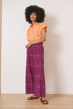 Pantalon droit aux jambes larges avec élastique au dos et deux poches italiennes bas tissu Ikat pour femme 