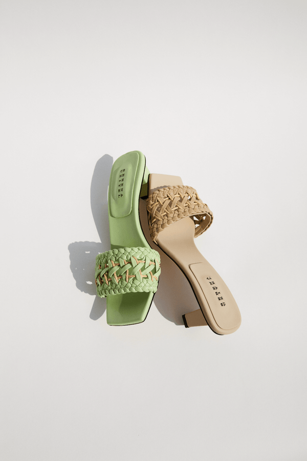 Almeria avocado mid-heel sandals showcasing open toe and braided strap design in green and beige leather.