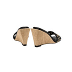 Stylish Almeria Black Wedge Sandal featuring a woven pattern and chic wedge heel design, perfect for summer fashion.