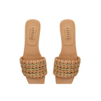 Aurnia Latte Flat Sandal featuring stylish woven straps and a comfortable flat sole, perfect for casual summer outings.