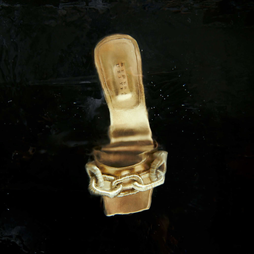 Catena Gold high-heel sandal with metallic leather and elegant chain detail, perfect for sophisticated events.