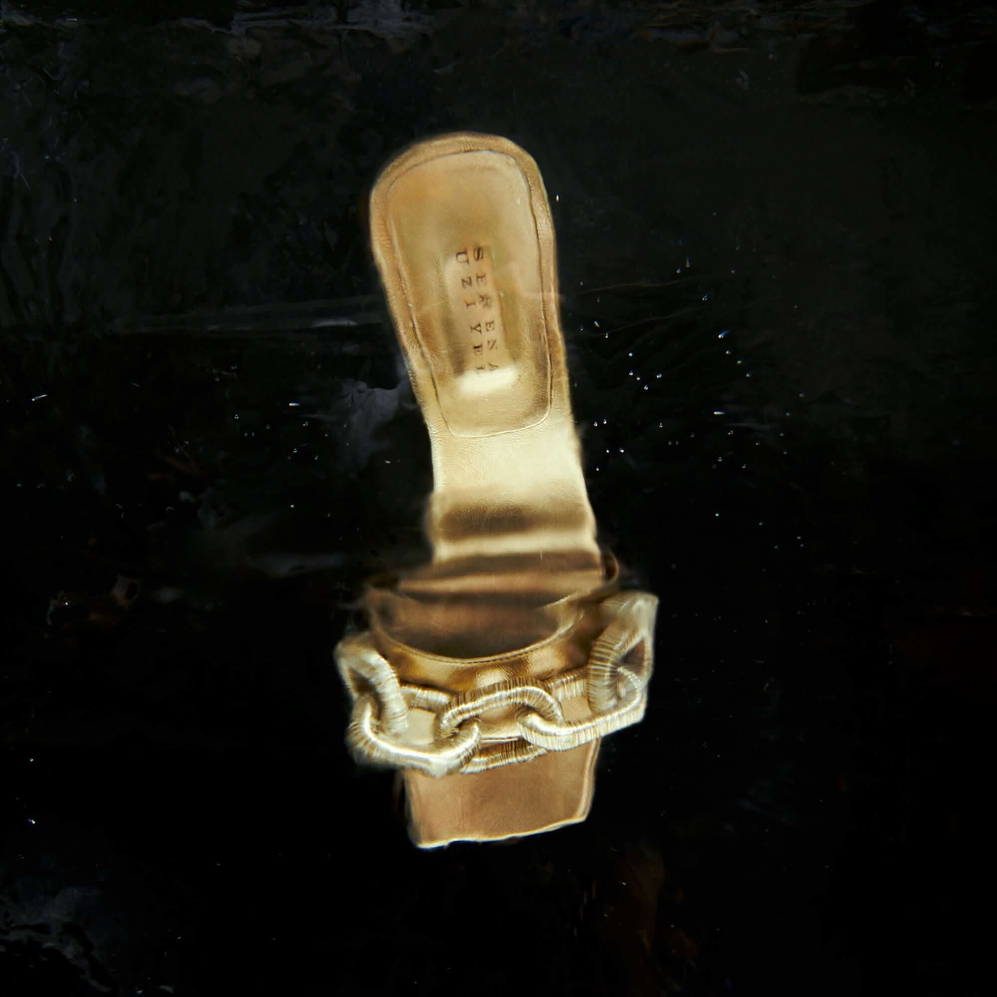 Catena Gold high-heel sandal with metallic leather and elegant chain detail, perfect for sophisticated events.