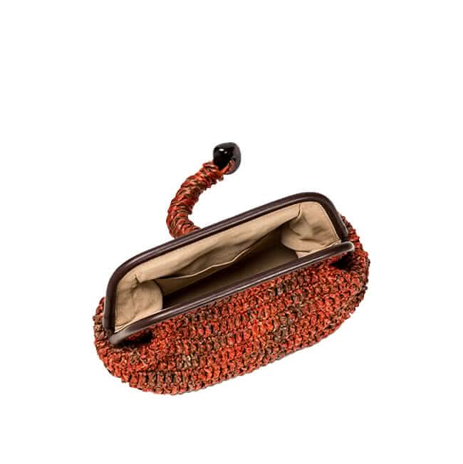 Delphine Ruggine pouch bag showcasing ruggine color raffia and an elegant interior, perfect for nature-inspired style.