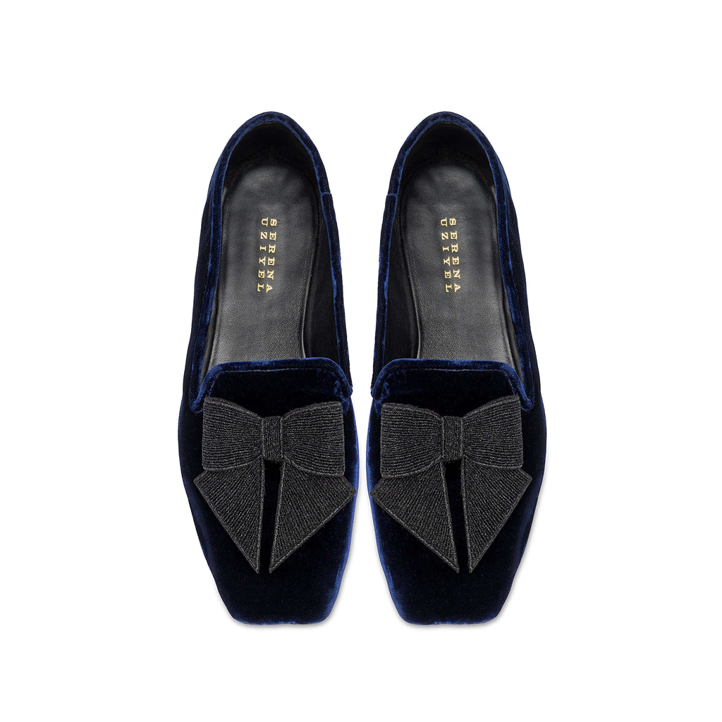 Fiocco Navy Flat Moccasin featuring elegant black embroidered bow on luxurious navy velvet, perfect for chic fall style.