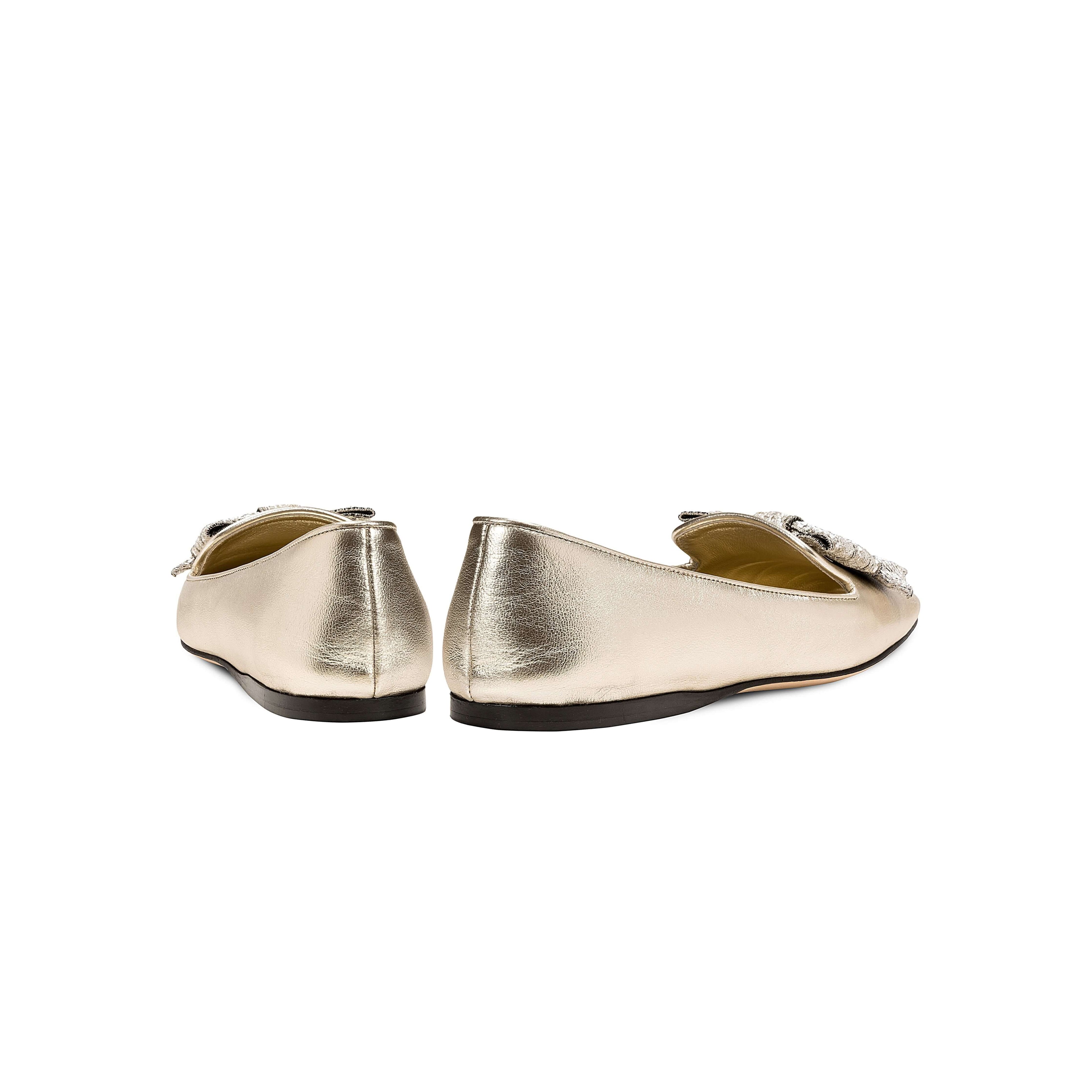 Back view of Fiocco Sahara Flat Moccasin in metallic leather with decorative bow, showcasing chic Fall footwear.