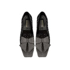 Fiocco Studs Flat Moccasin in black suede with crystal studs and a studded bow, ideal for chic winter styling.
