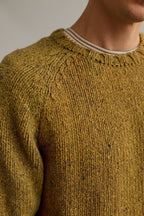 green knit flecked with colourful neps