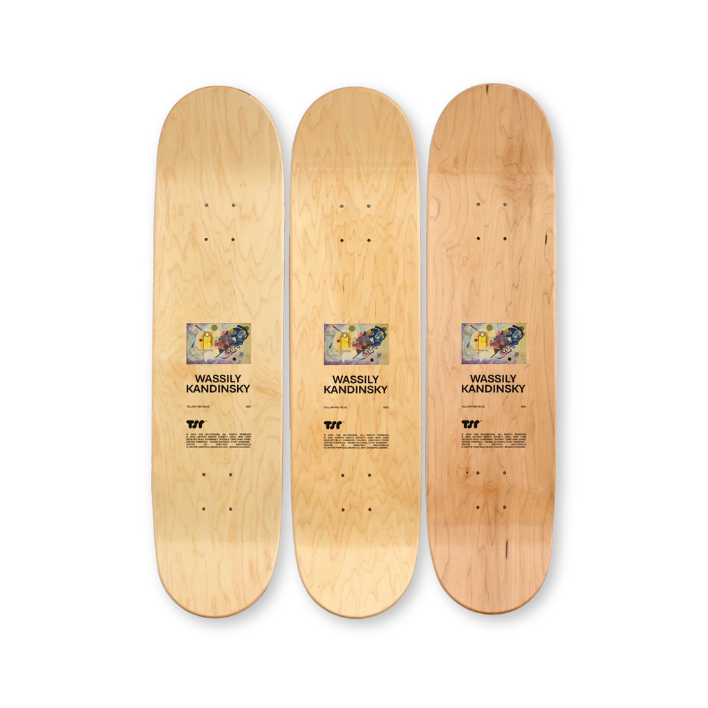 Top print of “Yellow-Red-Blue” triptych skateboard deck set by Wassily Kandinsky – natural wood grain finish with centered artwork reproduction and artist details on each deck, part of THE SKATEROOM x Kandinsky collection benefiting social skate projects.