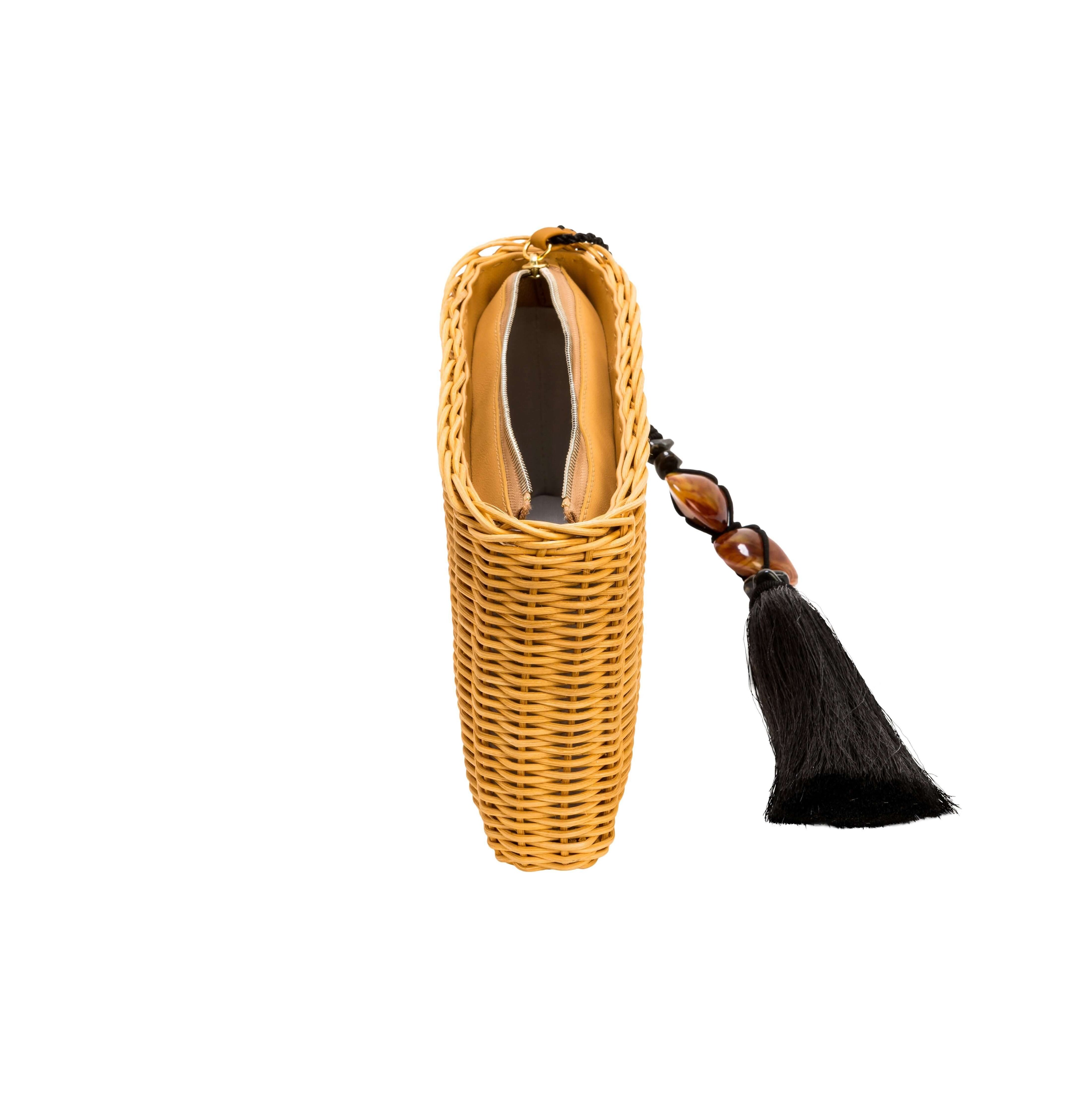 Melita natural clutch bag made from raffia with leather lining and stone tassel, perfect for summer nights.