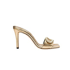 Naria Gold High-Heel Sandal with ornate oval embellishment and elegant Italian leather, showcasing a 90mm heel.