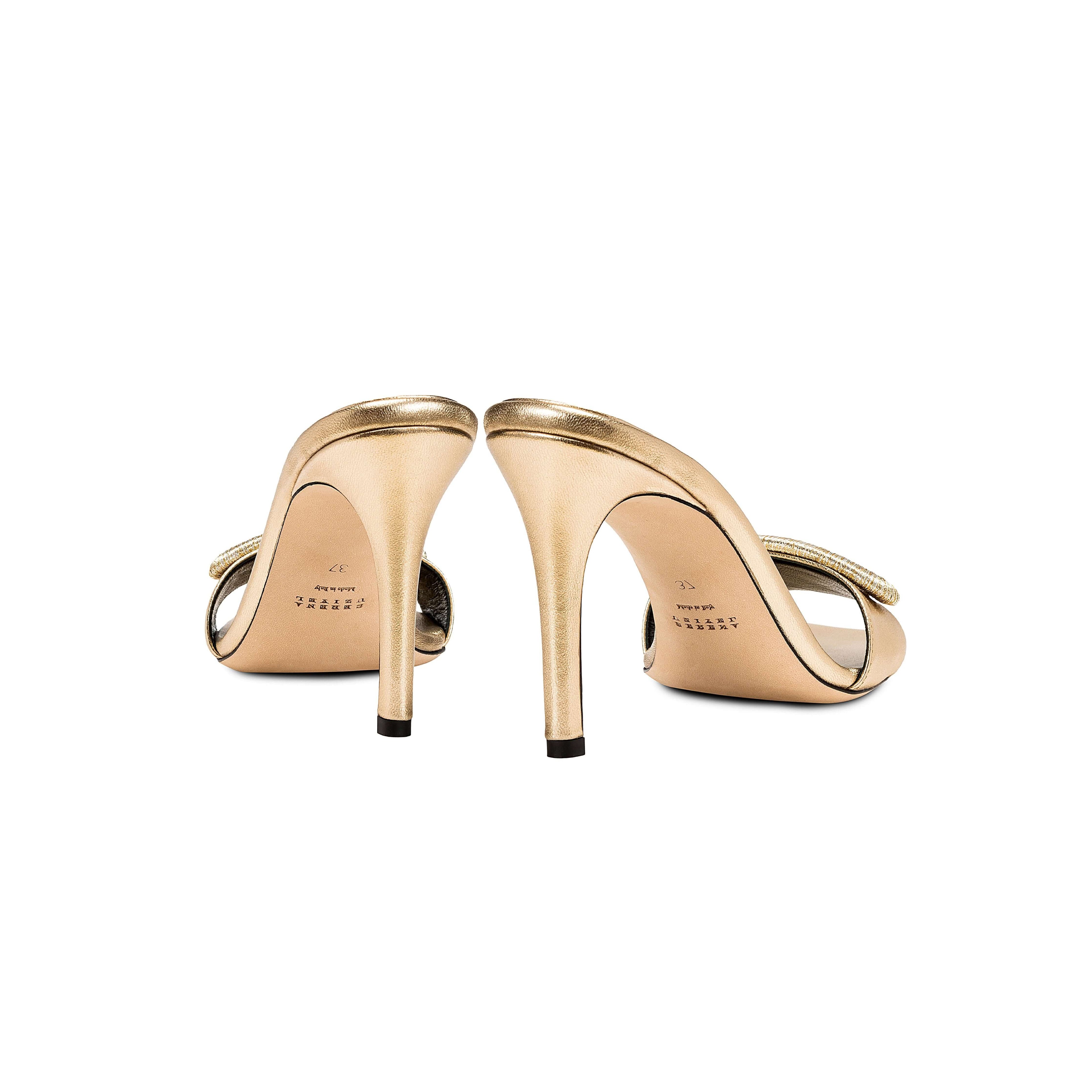 Naria Gold High-Heel Sandal showcasing elegant gold leather and a 90mm heel from a rear perspective.