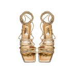 Ophilia Gold Flat Lace-Up Sandal in antique gold leather with braided straps for elegance and style.