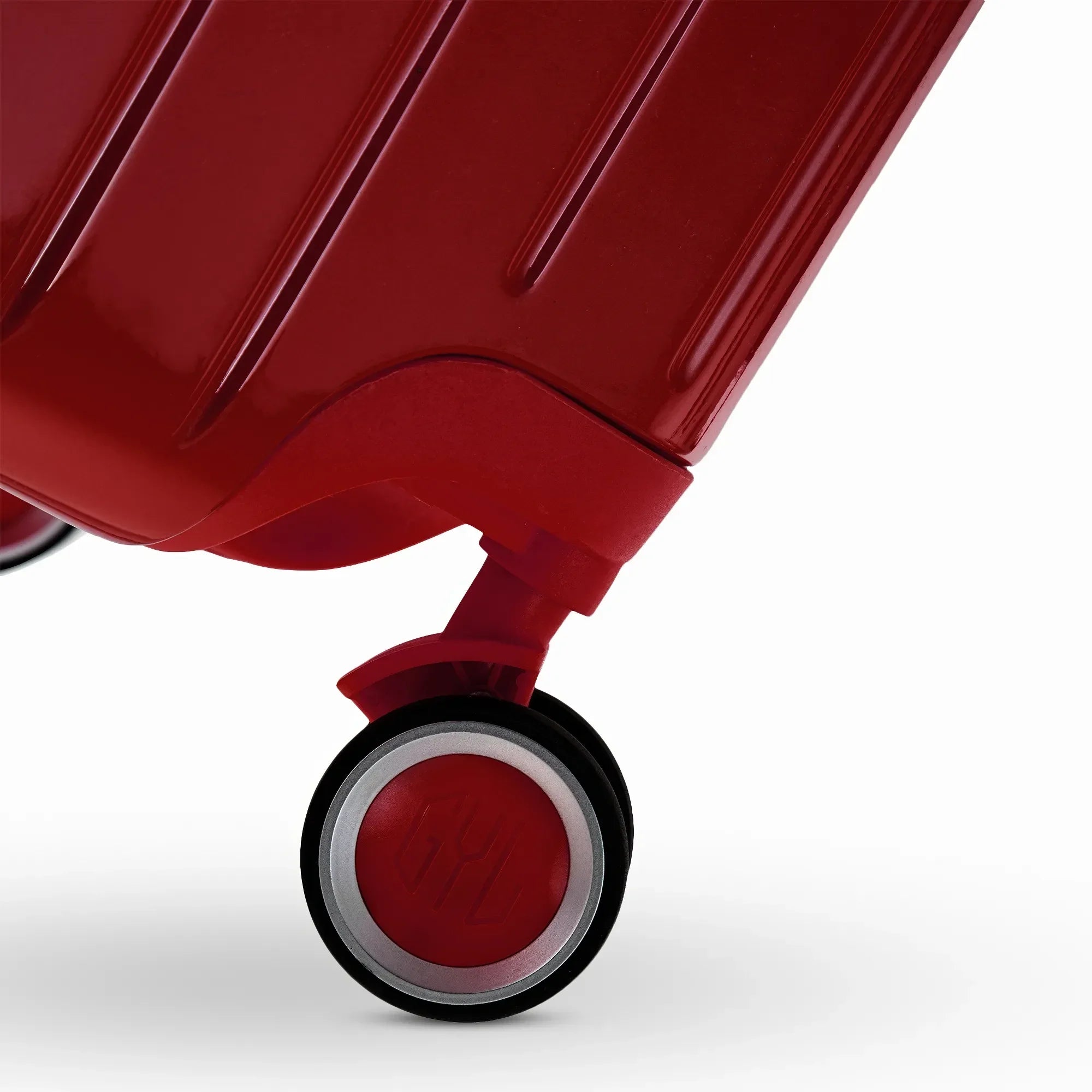 Roue double 360° de la valise GYL Intemporelle rouge foncé avec gravure du logo GYL sur le moyeu. #couleur_rouge foncé