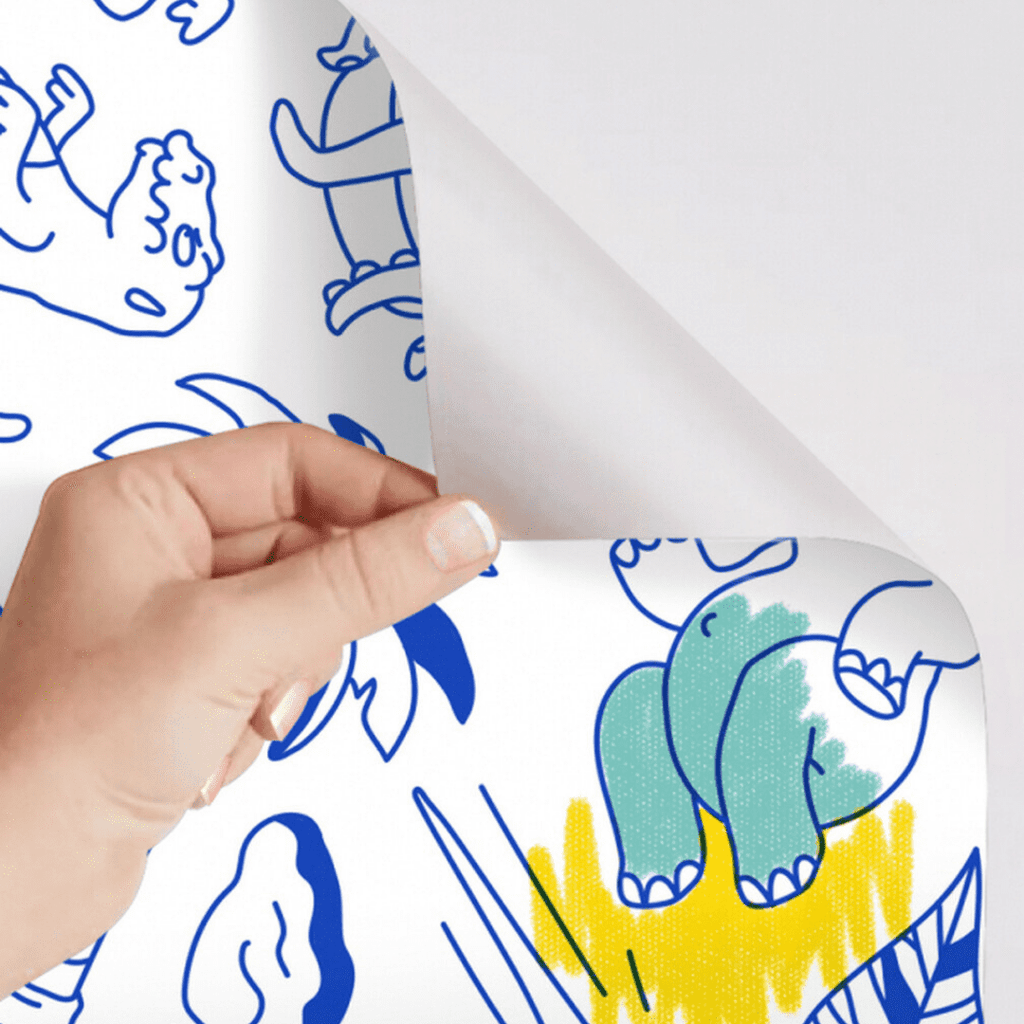 Démonstration de l’effet repositionnable du papier adhésif Stick-it Dinos avec motif colorié