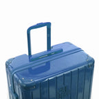 Poignée trolley télescopique GYL déployée sur la valise Intemporelle bleu grisé en polycarbonate. #couleur_bleu grisé