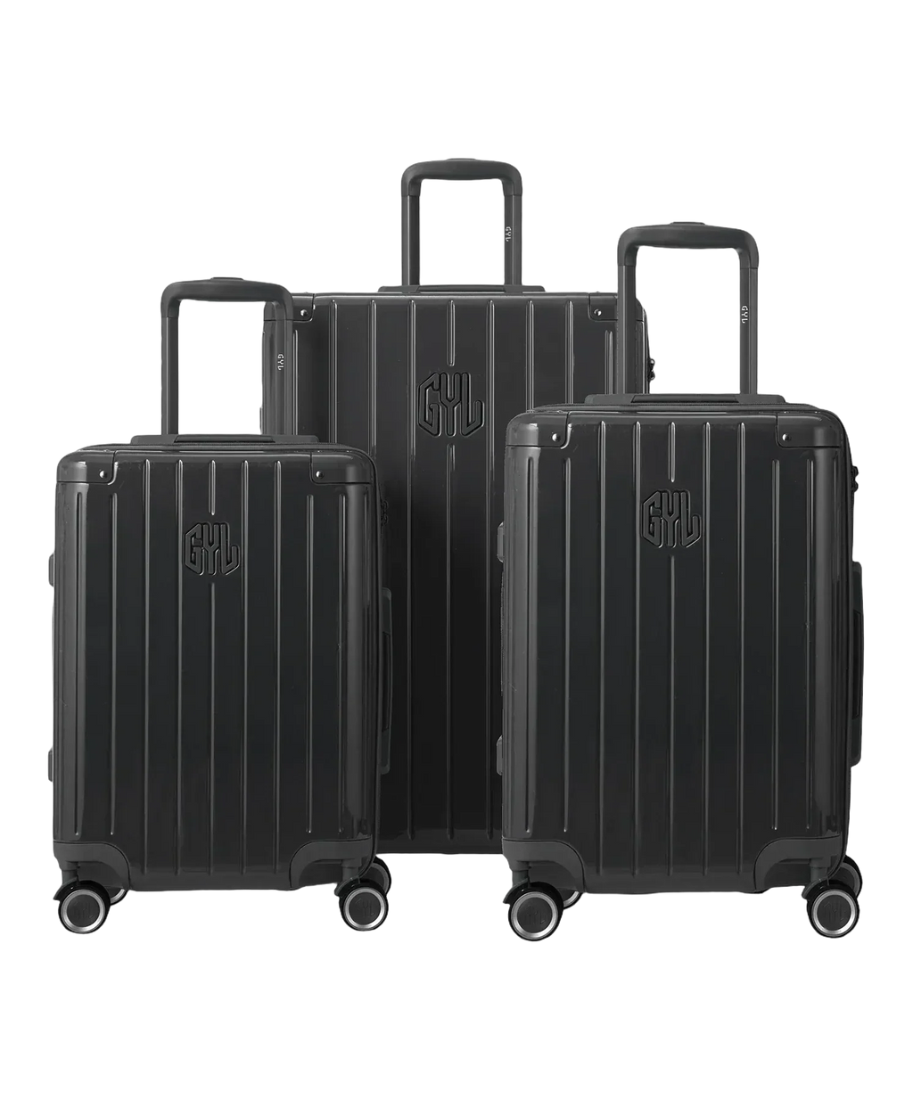 Set de 3 valises Intemporelle en polycarbonate cabine, semaine et soute coloris gris foncé glossy vue de face avec logo GYL, packshot GYL