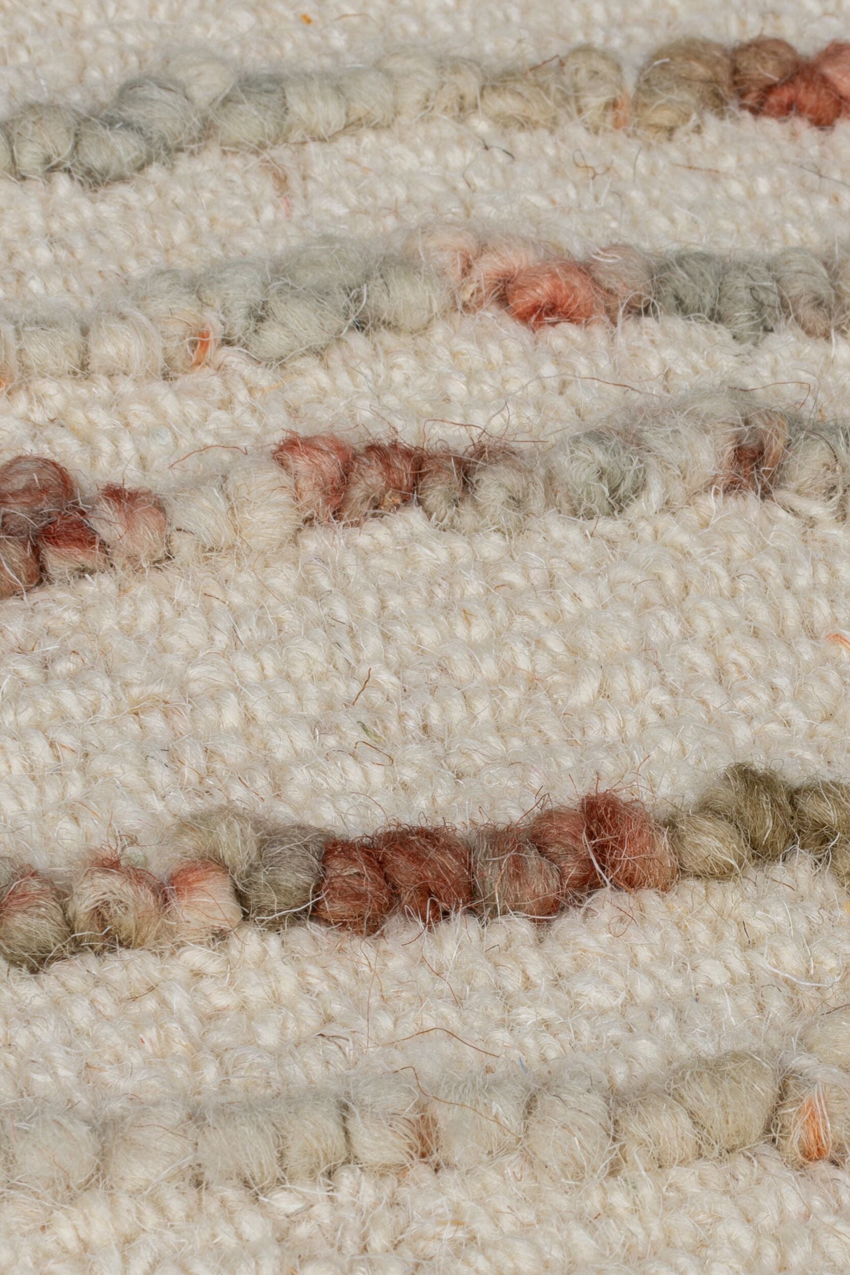 zoom sur la matière et son tissage du tapis swirl coloris orange et naturel#couleur_naturel-orange